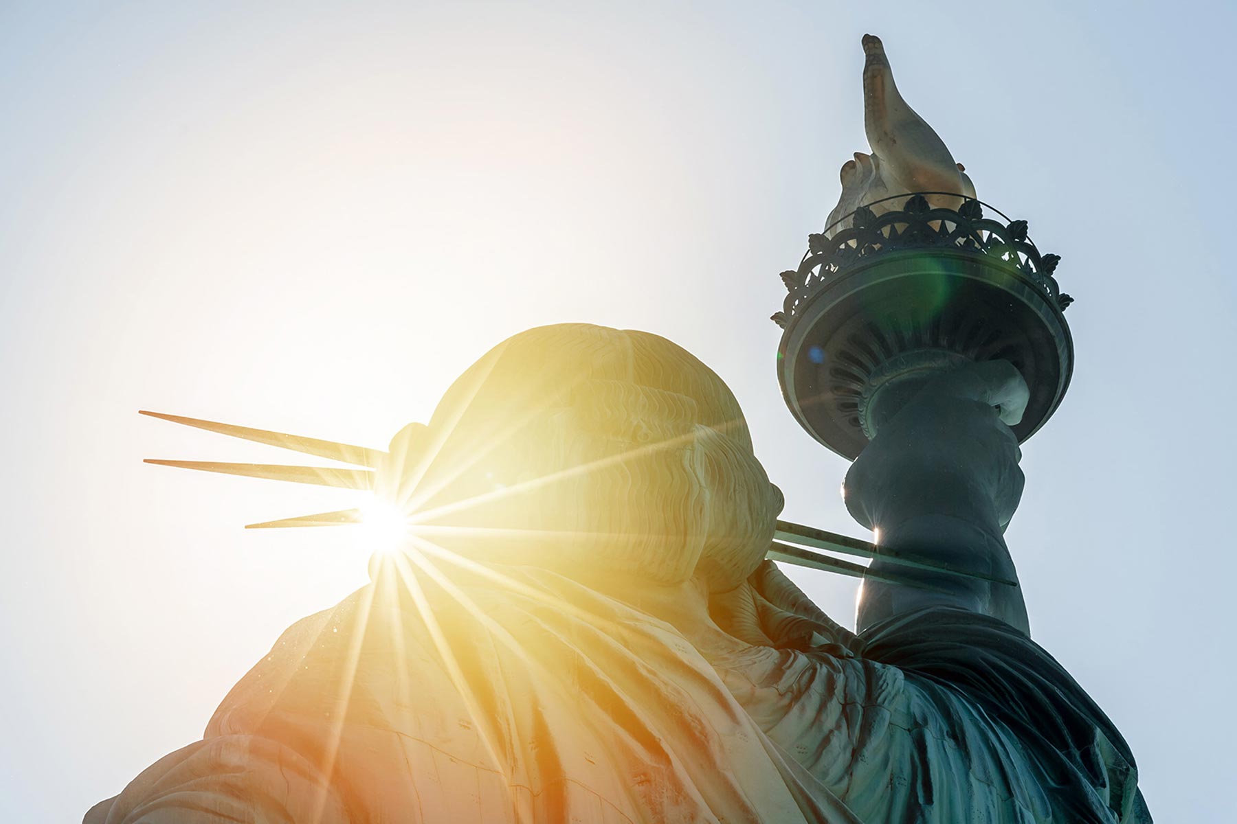 sun shining behind statue of liberty smithtown ny