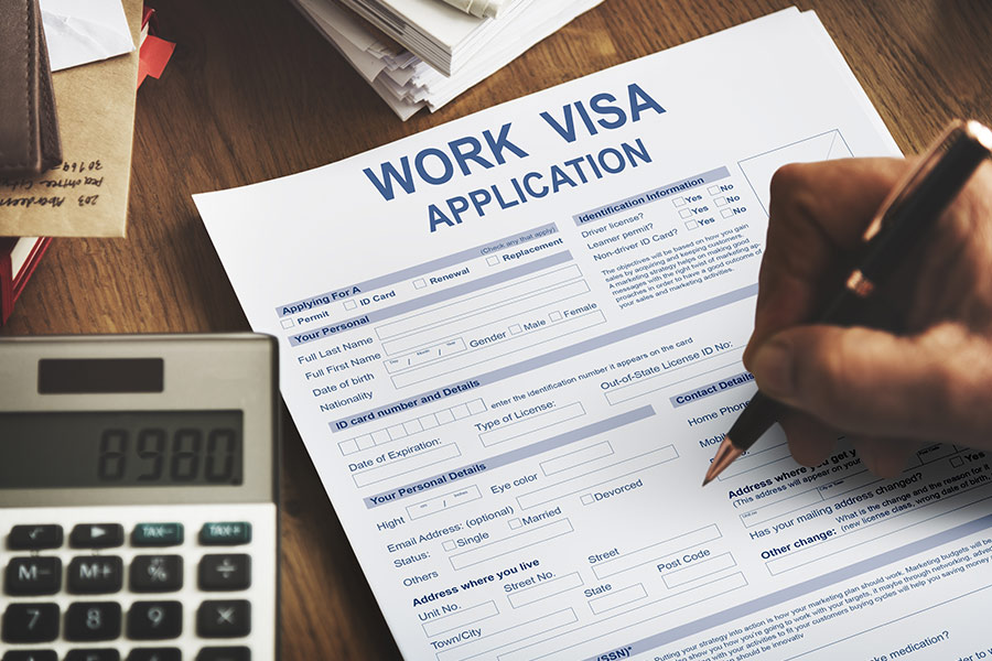 person filling out work visa application smithtown ny